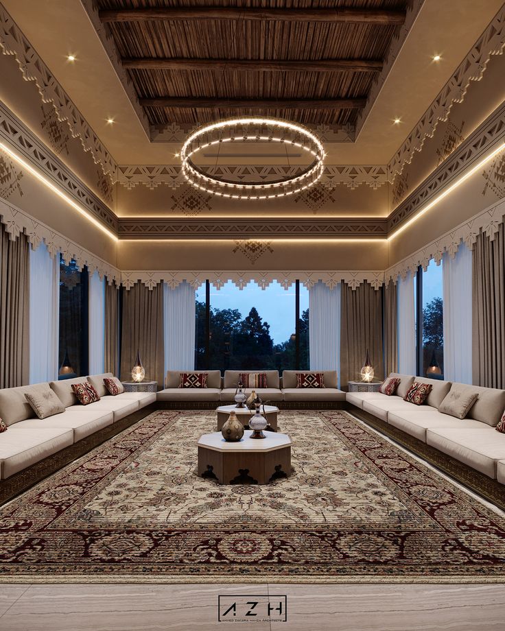 a large living room with many couches and lamps on the ceiling, along with an area rug