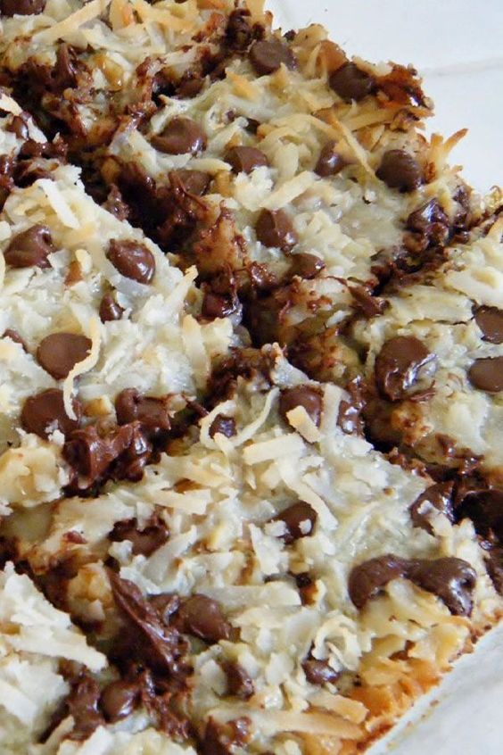 chocolate and coconut bars are stacked on top of each other, ready to be eaten