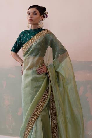 Green pure tissue silk saree with a sequin and thread hand embroidered border. Paired with a padded blouse with back tassel tie-up and petticoat. - Aza Fashions Green Tissue Saree, Embellished Saree, Saree For Wedding, Tissue Silk Saree, Tissue Saree, Padded Blouse, Embroidered Saree, Green Saree, Embroidered Border