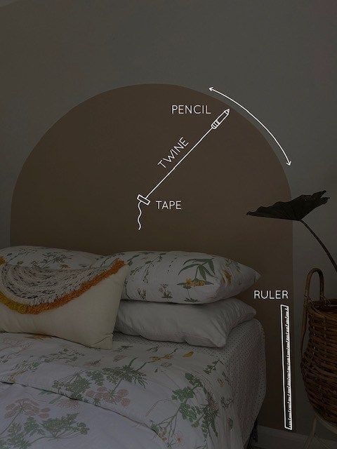 a bed with two pillows and an arch in the wall that says pencil time tape