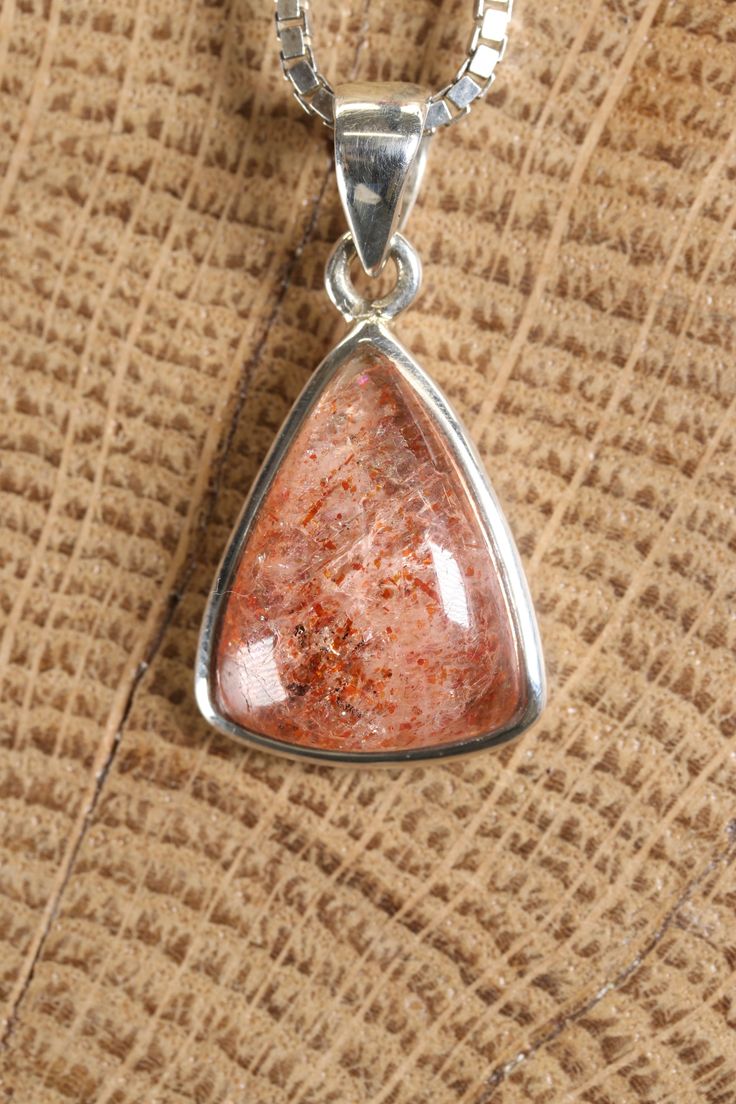 Sunstone Pendant Approx. Dimensions: 22x20x6 mm This pendant is made with .925 Sterling Silver. Chain is not included. Sunstone is a beautiful and unique feldspar mineral known for its shimmering and sparkling appearance. It belongs to the same mineral family as moonstone and labradorite, and it's valued for its warm colors and intriguing optical effects. Sunstone is primarily composed of a variety of feldspar known as oligoclase, often with the presence of hematite or goethite inclusions that c Silver Mineral Crystal Gemstones As Gifts, Silver Mineral Crystal Gemstones For Gifts, Silver Sunstone Jewelry With Gemstone, Silver Sunstone Jewelry As A Gift, Silver Sunstone Jewelry For Gift, Silver Sunstone Jewelry With Natural Stones, Sunstone Gemstone For Jewelry Making, Sunstone Gemstone Jewelry For Jewelry Making, Sunstone Gemstone Jewelry As Gift