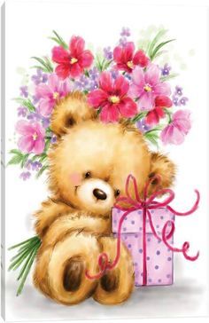 a brown teddy bear sitting next to a pink box with flowers on it's head