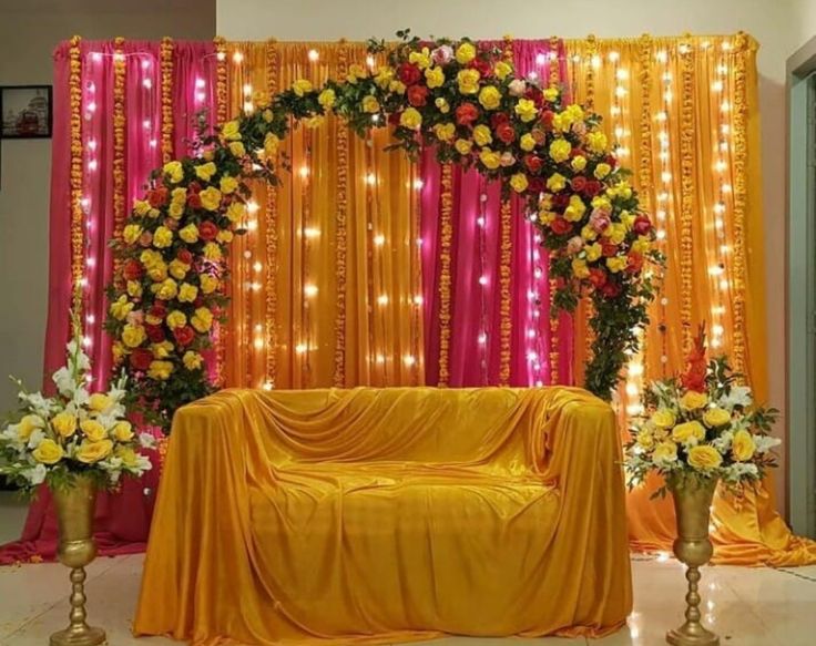 a decorated stage with flowers and lights