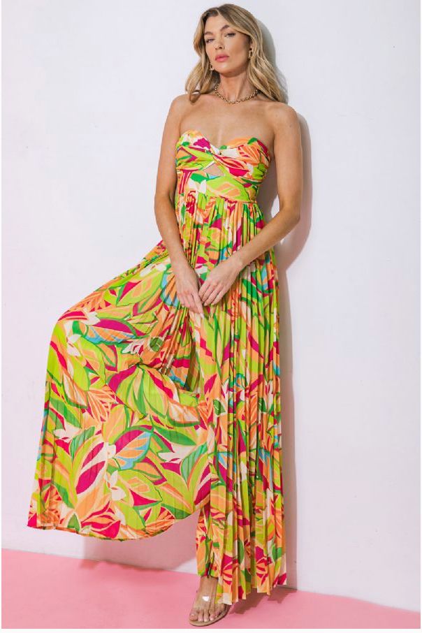 The Pura Vida Jumpsuit, a stunning multi-colored jumpsuit that combines comfort and style effortlessly. Crafted with a vibrant tropical print, this multi-colored jumpsuit is perfect for any occasion, whether it's a beach vacation, a garden party, or a casual day out. e.Laniese founder wears a size Small in this jumpsuit. Casual Tropical Print Maxi Dress For Garden Party, Casual Maxi Dress With Tropical Print For Garden Party, Tropical Style Maxi Dress For Summer Garden Party, Tropical Printed Maxi Dress For Spring, Spring Tropical Printed Maxi Dress, Summer Floral Print Jumpsuits For Beach Season, Tropical Maxi Dress With Floral Print For Day Out, Summer Floral Print Jumpsuits And Rompers For Beach Season, Casual Jumpsuits And Rompers With Tropical Print For Summer