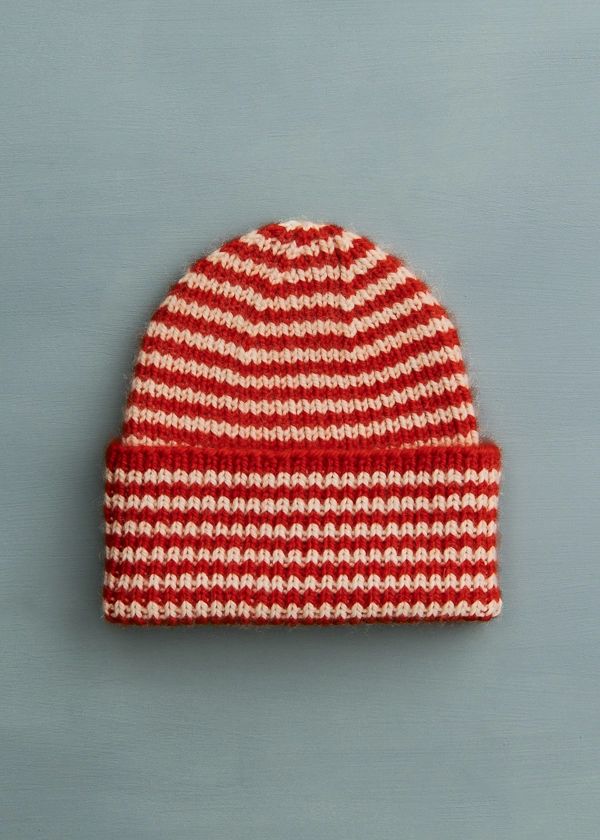 a red and white striped knitted hat