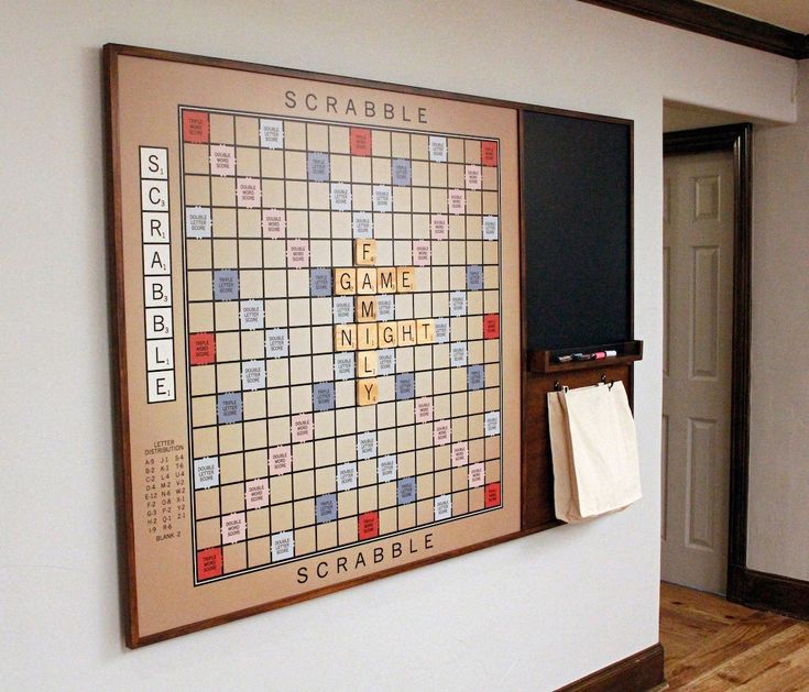 a scrabble board hanging on the wall