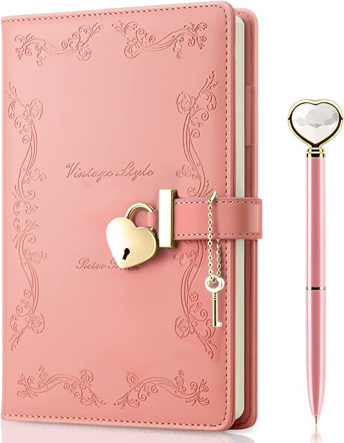 a pink notebook with a key attached to it