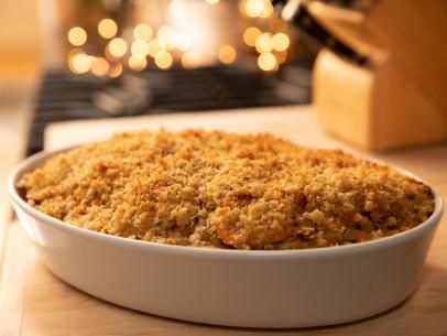 a casserole dish filled with crumbs on top of a wooden table