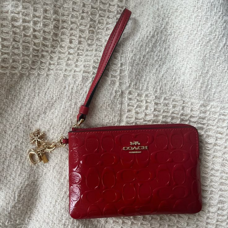 Never Used, Wristlet With Charms Small Coach Wallet, Red Coach Wallet, Red Wristlet Clutch With Removable Pouch, Elegant Red Coach Wallet, Elegant Red Wristlet With Zipper Pouch, Coach Red Wristlet With Zipper Closure, Red Coach Wristlet With Zipper Closure, Red Pouch Wallets With Wrist Strap, Red Clutch Wristlet With Removable Pouch