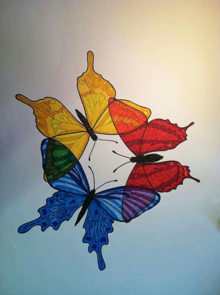 three colorful butterflies flying in the sky with their wings spread out to look like they are holding onto each other