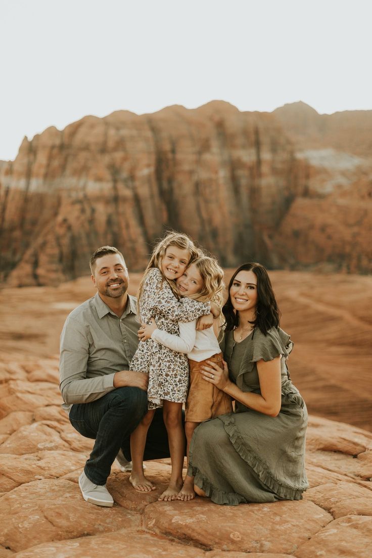 a family posing for a photo in the desert