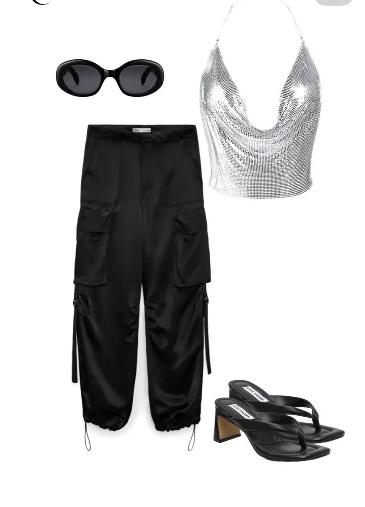 a pair of black pants, silver top and sunglasses