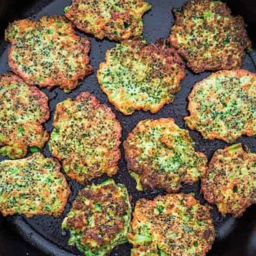 some broccoli patties are cooking in a skillet