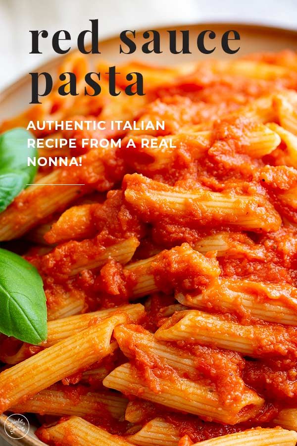 red sauce pasta in a white bowl with basil leaves on top and the words authentic italian recipe from a real nonna