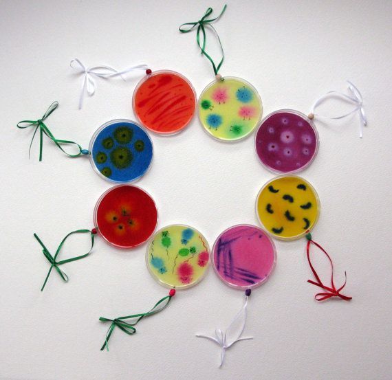 a group of colorful buttons sitting on top of a white table