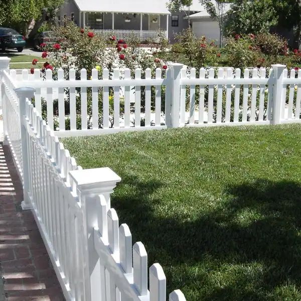 a white picket fence in front of a house