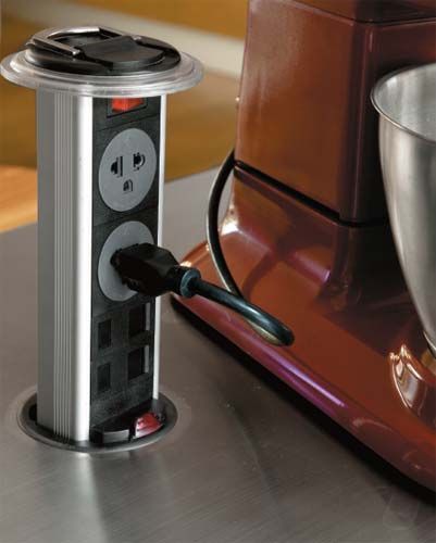 an image of a coffee maker on the counter with its lid open and plugged in