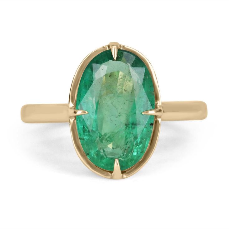 Oval Emerald Birthstone Ring In Fine Jewelry Style, Heirloom Oval Emerald Ring, Timeless Yellow Gold Emerald Ring With Oval Shape, Oval Emerald Ring With Bezel Setting, Timeless Yellow Gold Oval Emerald Ring, Timeless Oval Emerald Rings, Timeless Oval Emerald Ring With Bezel Setting, Timeless Oval Emerald Jewelry, Oval Emerald Ring With Prong Setting