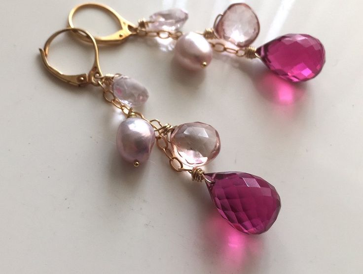 A gorgeous faceted pink ruby quartz teardrop is paired with morganite pink quartz, pink freshwater pearl and mystic pink quartz.Fresh and beautiful. The 14k gold filled LEVERBACKS are factored into this price. If you want French open earwires let me know but the price is the same. 14k gold filled chain. Length is about 2.25".Your jewelry will arrive beautifully giftboxed. Pink Briolette Jewelry For Wedding, Elegant Pink Faceted Earrings, Pink Briolette Earrings As Gift, Pink Briolette Earrings For Gift, Pink Briolette Earrings With Natural Stones, Pink Briolette Earrings For Wedding, Pink Briolette Natural Stone Earrings, Pink Teardrop Earrings With Natural Stones, Pink Gemstone Teardrop Earrings