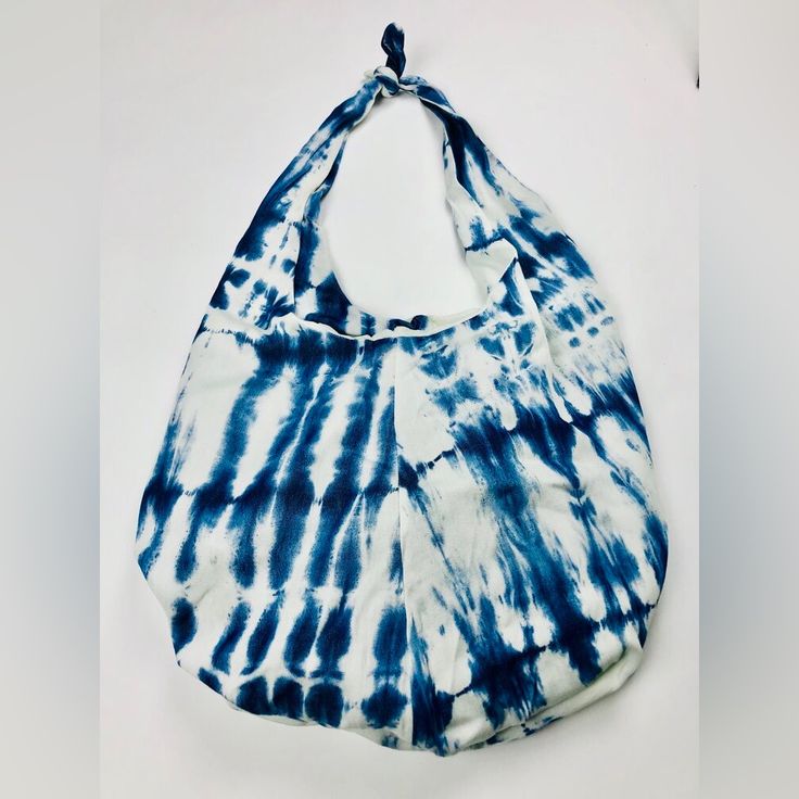 Made In The Usa Limited Quantity “One Of A Kind” Boho Bag Roomy And Light Weight. This Denim Boho Sling Features A Top Knot That Allows You To Choose A Custom Length. This Bag Makes Any Outfit Instantly Cute. Details- Color: Tie Dye- Indigo Blue And White Bag: Boho Sling Dimensions: 15”H X 13'“L Top Knot/ Bow Denim Tie Dye Strap Drop: 13” Lined Blue Casual Hobo Bag For Daily Use, Casual Blue Hobo Bag For Daily Use, Casual Blue Crossbody Hobo Bag, Summer Hobo Beach Bag For Everyday Use, Trendy Blue Hobo Shoulder Bag, Everyday Blue Hobo Bag, White Crossbody Hobo Bag For Summer, Casual Hobo Beach Bag For Everyday Use, White Casual Hobo Tote Bag