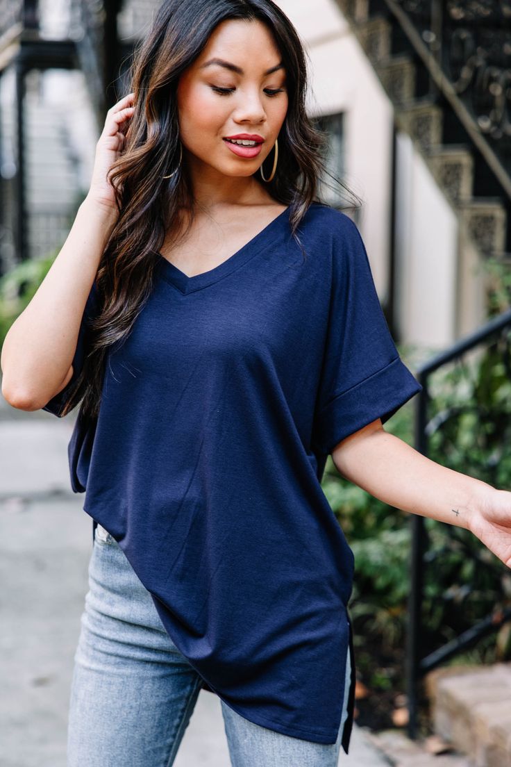 This versatile v-neck tee is here to make your life easy! It's honestly the perfect top for year round styling and layering. You can knot the hem or half tuck into your favorite jeans or shorts. You can layer it with all sorts of jackets, shackets, or kimonos. And don't even get us started on accessories! The options are absolutely endless! This top is truly a staple piece! This top features a v neckline, short cuffed sleeves, and a generous fit.Material has generous amount of stretch. Cindy is Casual V-neck Top For Layering With Relaxed Fit, Casual V-neck Top With Relaxed Fit For Layering, Blue V-neck Top For Everyday, Blue V-neck Top For Everyday Wear, Versatile V-neck Top For Casual Gatherings, Trendy Blue Tops For Casual Gatherings, Trendy V-neck T-shirt For Layering, Casual Summer V-neck Top For Layering, Mint Julep Boutique