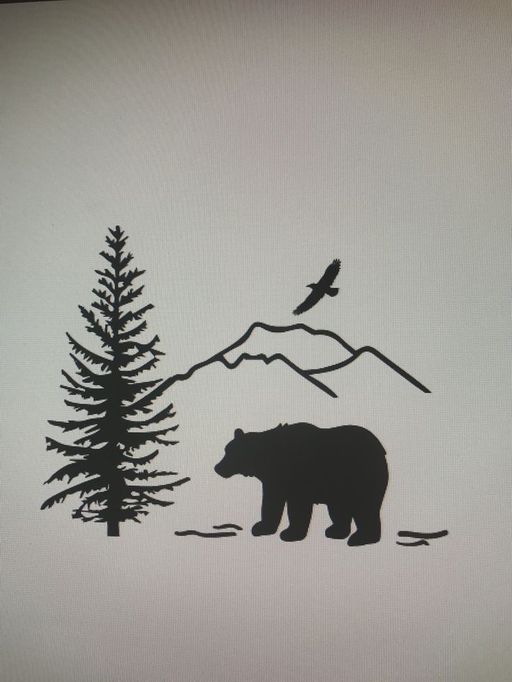 a bear and bird are silhouetted against the backdrop of a pine tree, with a mountain range in the background