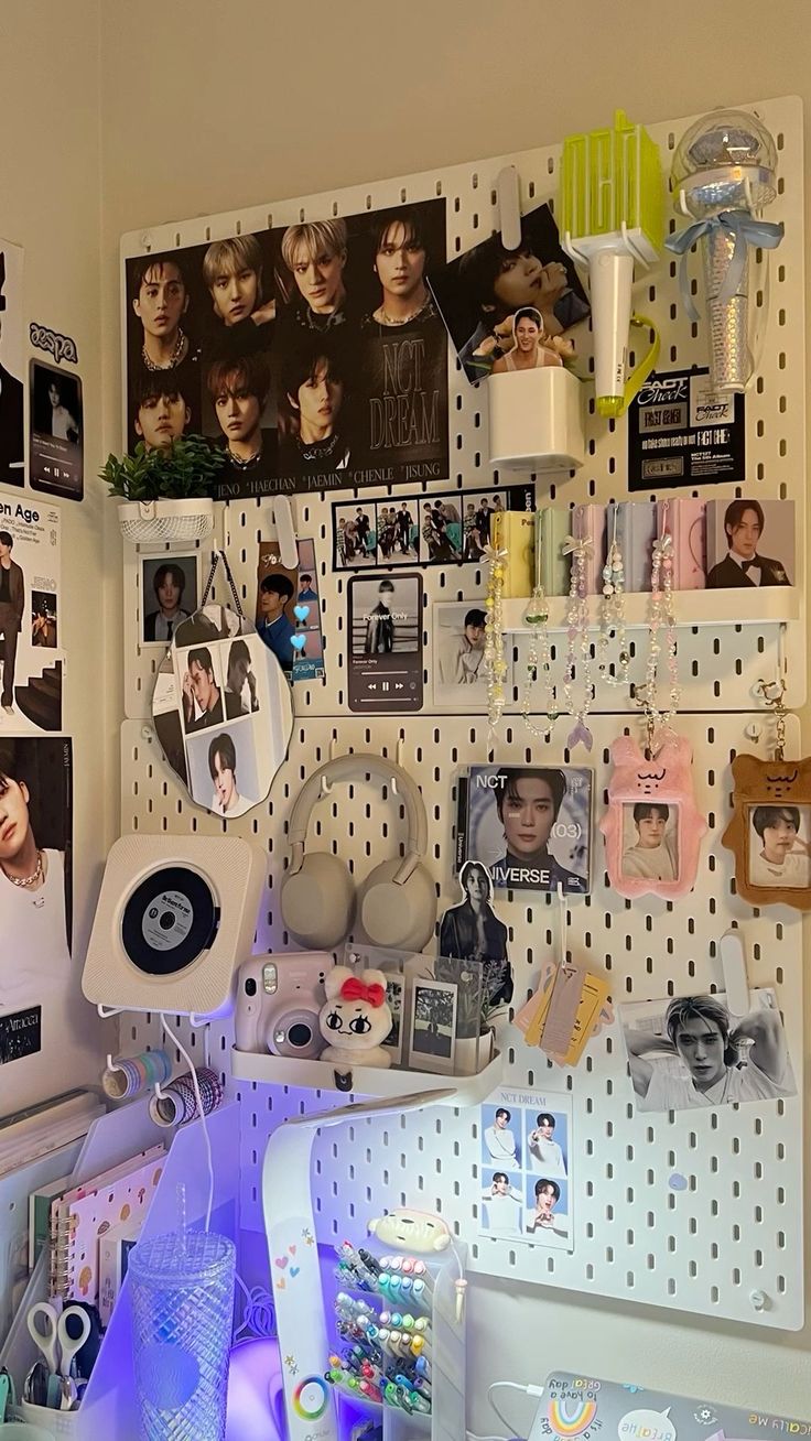 there are many pictures on the pegboard in this room and it is very cluttered