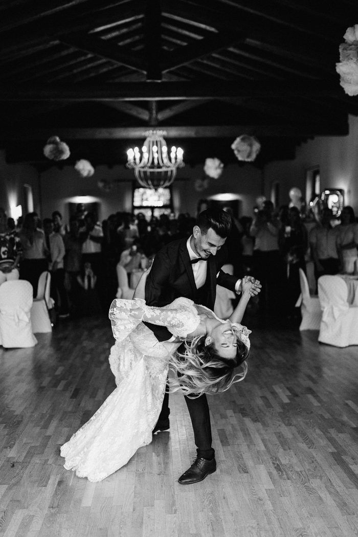 a bride and groom are dancing on the dance floor