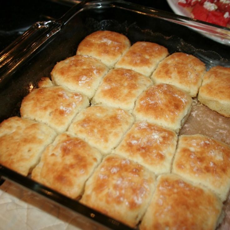 a pan filled with lots of food sitting on top of a table