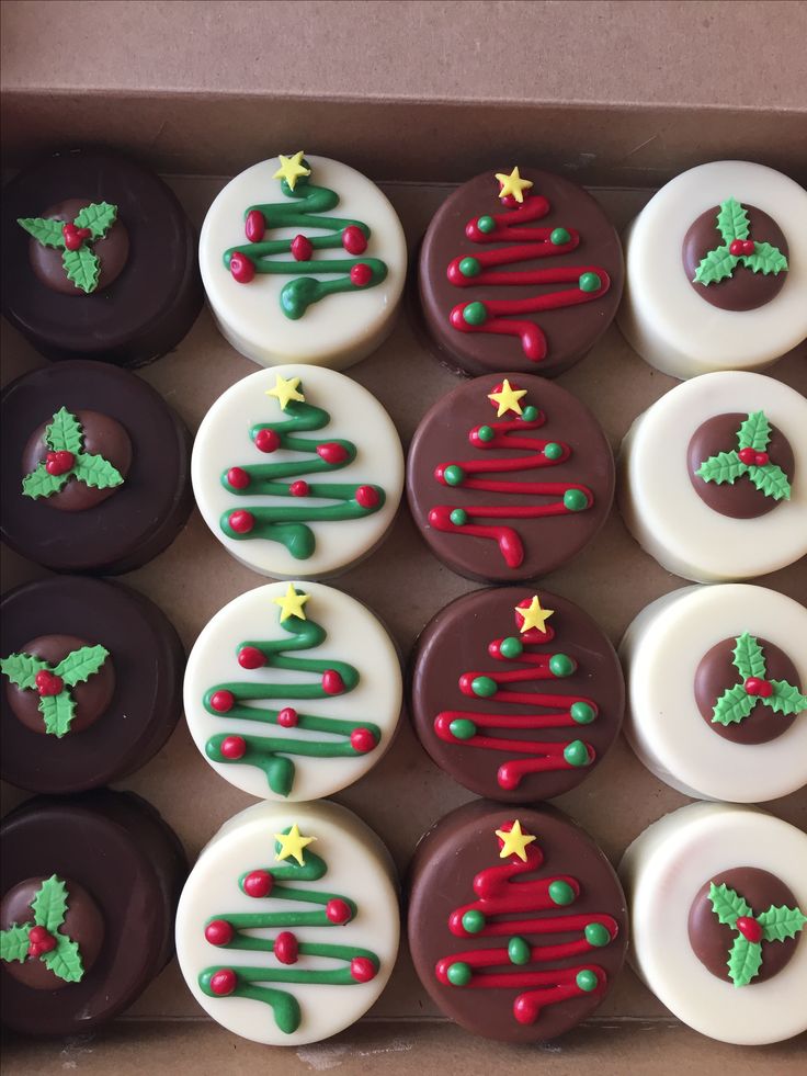 a box filled with lots of decorated donuts