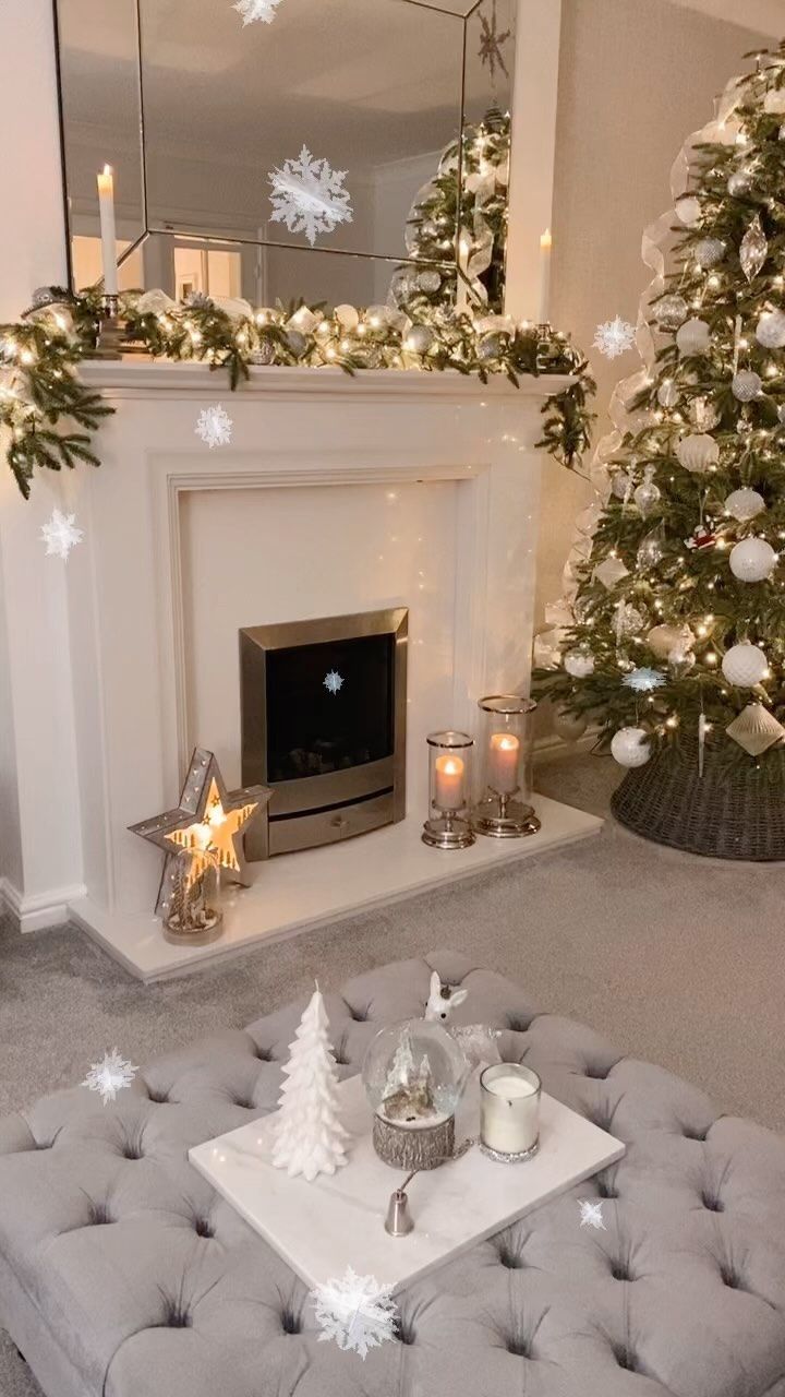 a living room filled with furniture and a christmas tree in front of a fire place