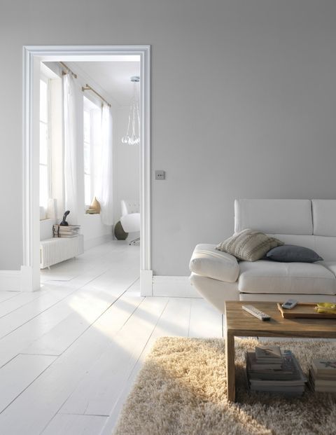 a living room with white walls and flooring