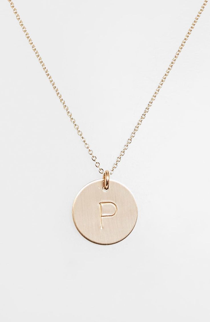 From humble beginnings to a fully staffed warehouse in Bend, Oregon, Nashelle remains true to its original purpose-handmade jewelry crafted with love and intention. The initial necklace is no different, with a hand-stamped pendant centered on a delicate chain-link. Style Name:Nashelle 14K-Gold Fill Initial Disc Necklace. Style Number: 813137. Available in stores. 14k Gold Tarnish-resistant Initial Necklace, Personalized 14k Gold Necklace For Everyday, Minimalist Rose Gold Jewelry With Initials, Classic Everyday Jewelry With Round Pendant, Classic Jewelry With Round Pendant For Everyday, 14k Gold Filled Initials Necklace For Everyday, Engraved 14k Gold Filled Jewelry, Engraved 14k Gold-filled Jewelry, Minimalist Engraved 14k Gold Filled Jewelry