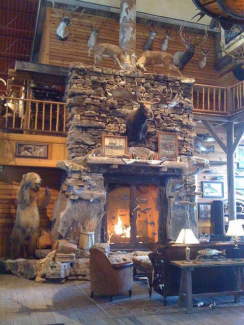 a large stone fireplace sitting inside of a living room