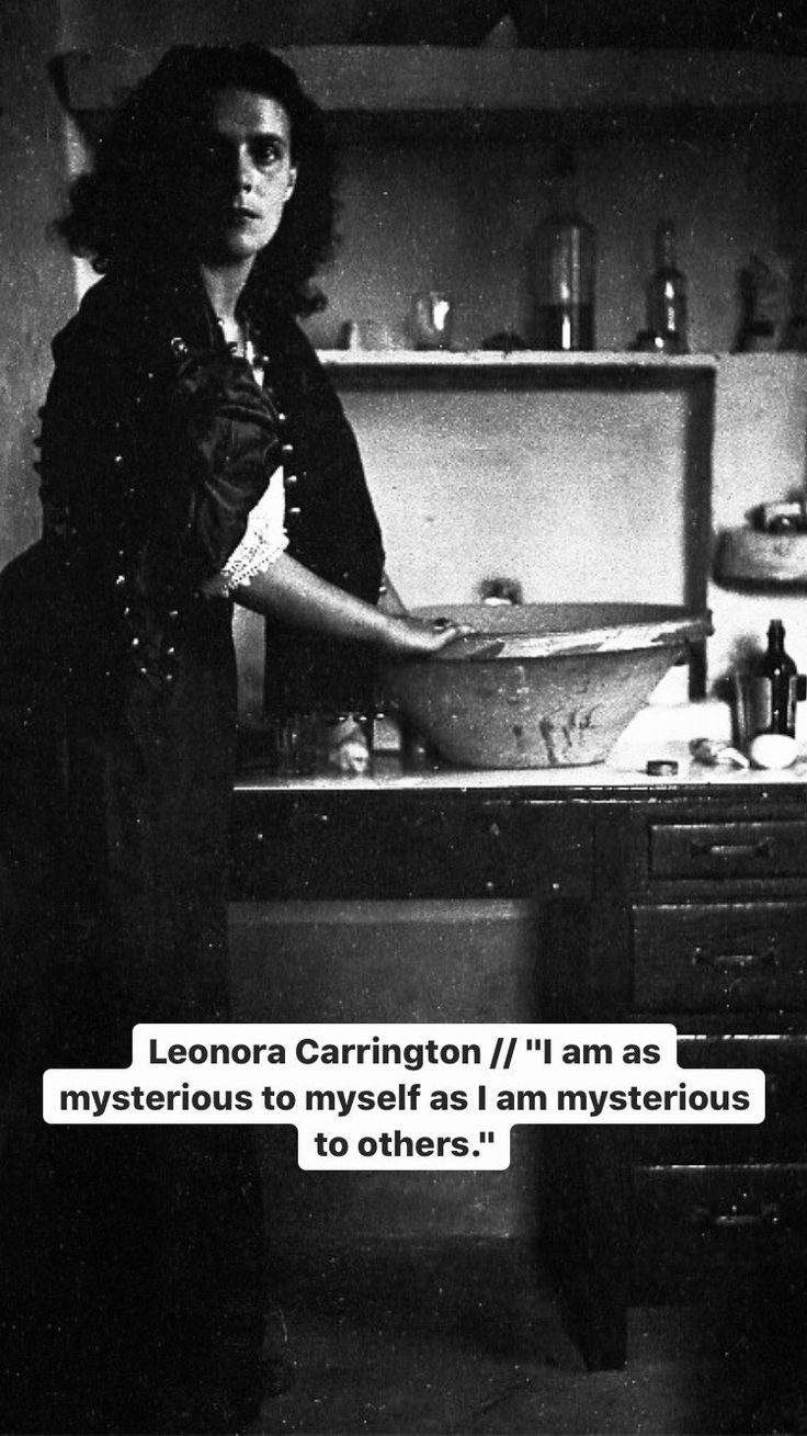 a woman standing in front of a sink with a quote above it that reads, leonora carrington / i am as mysterious to my self as i am mysterious to others