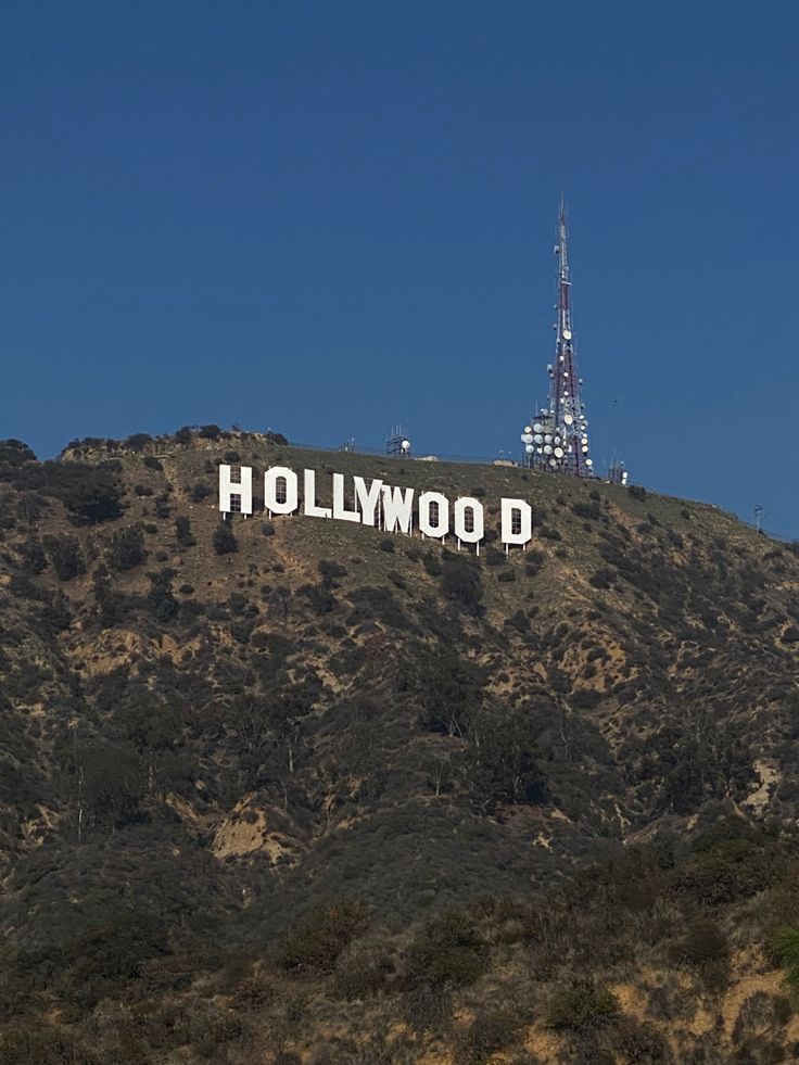 the hollywood sign is on top of a hill