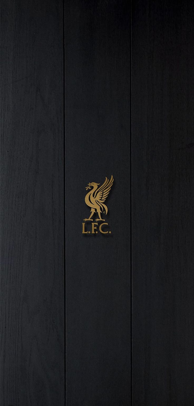 a black and gold door with the lfc logo on it