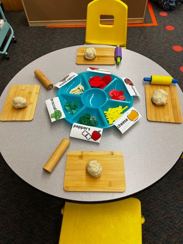 a child's play table with food on it