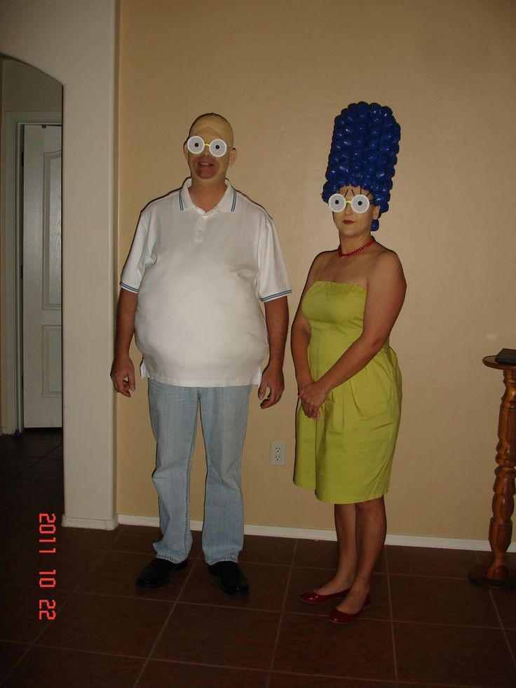 a man and woman in costumes standing next to each other