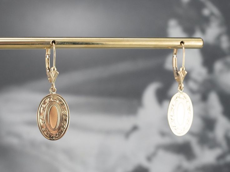 These beautiful earrings were handcrafted by our studio, using pieces of antique cufflinks! The handsome, sophisticated dangles are a beautiful yellow 14k gold that is chased with beautiful scrolling details! These date to the Victorian era! We've created bails and hung them on leverbacks of 14K yellow gold. Metal: 14K Yellow Gold Earrings Length: 32 mm Earrings Width: 11 mm Marks: “14K” Stamped on the reverse Antique Cufflinks, Drop Earrings Gold, Yellow Gold Earrings, Yellow Gold Earring, Gold Drop Earrings, Victorian Era, Eternity Bands, Beautiful Earrings, Bridal Jewelry