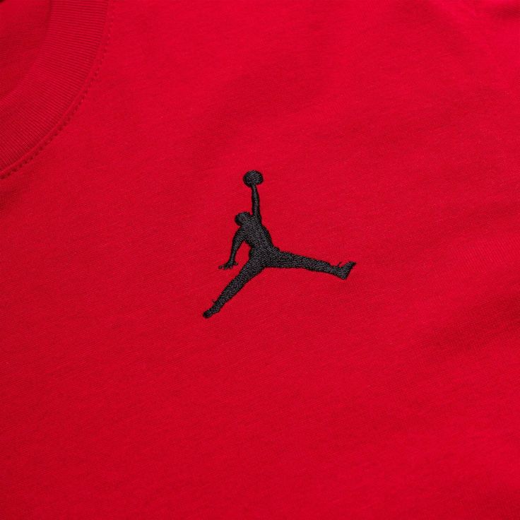 a red shirt with a black jordan logo on it