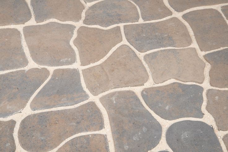 The naturally-weathered look of the Alameda patio stone provides an element of customization to every walkway, patio or outdoor project. Single unit installation simplifies the creation of stunning outdoor spaces, transforming your project into a showpiece. Lowe's 13-in L x 11-in W x 2-in H Irregular Charcoal/Tan Concrete Patio Stone in Gray | 12052485 Diy Stone Patio, Paver Steps, Patio Stone, Patio Flooring, Concrete Patio, Country Style Homes, Patio Stones, Stone Work, Landscape Projects