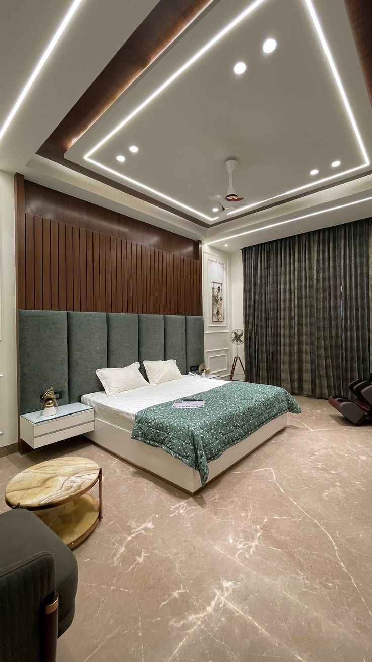 a bedroom with a large bed sitting in the middle of it's flooring