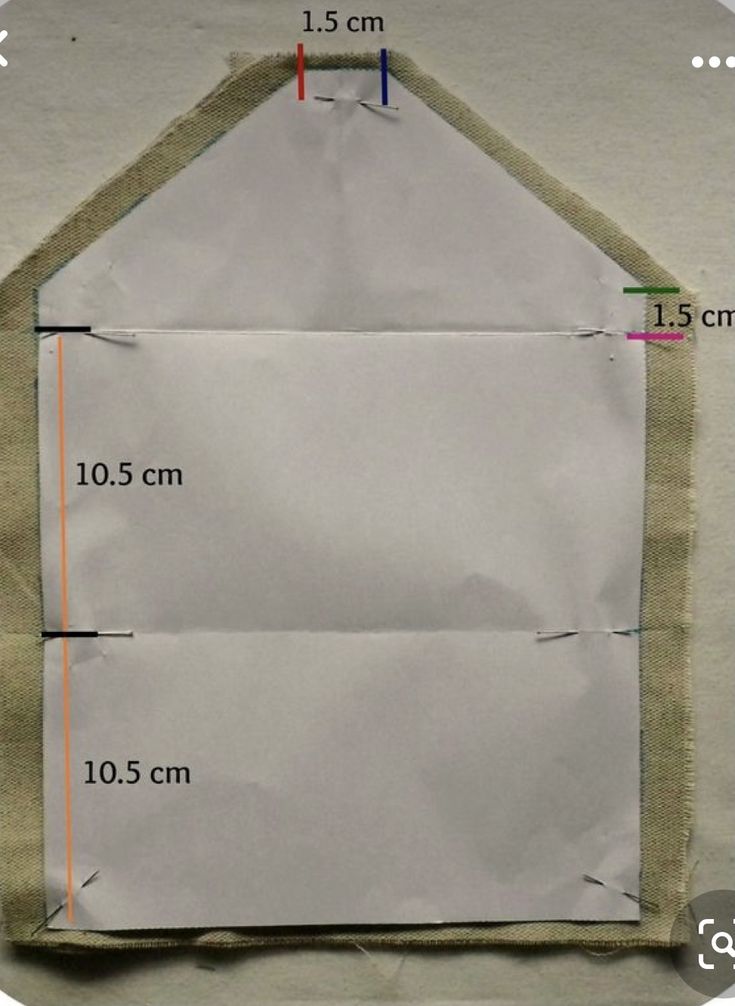 an envelope with the measurements cut out