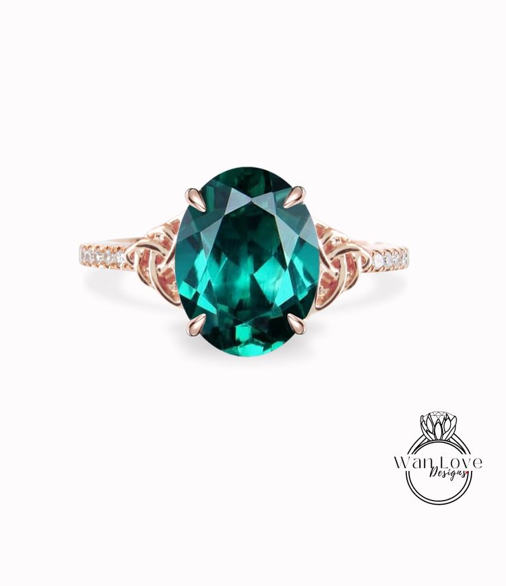 an oval cut green tourmaline ring with diamond accents on the band and shoulders