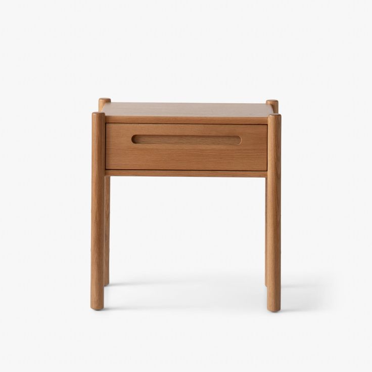 a small wooden table with one drawer open