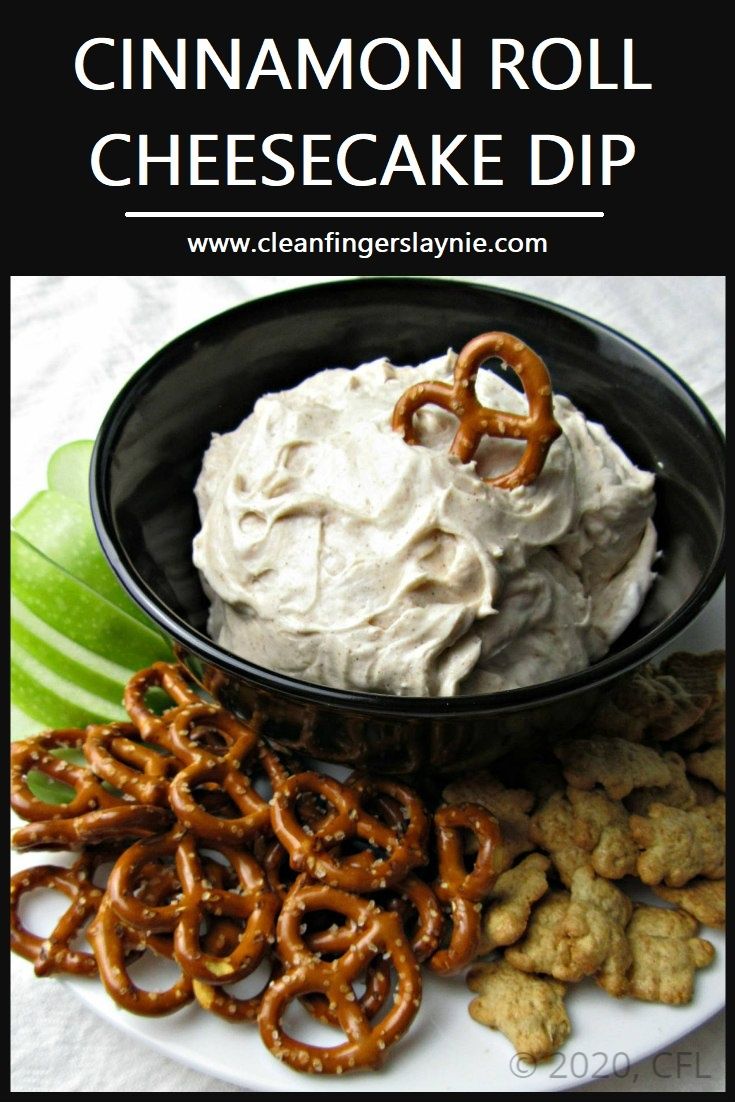 a plate with pretzels, crackers and whipped cream on it that says cinnamon roll cheesecake dip