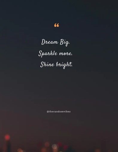 the words dream big sparkle more shine bright are in front of a cityscape