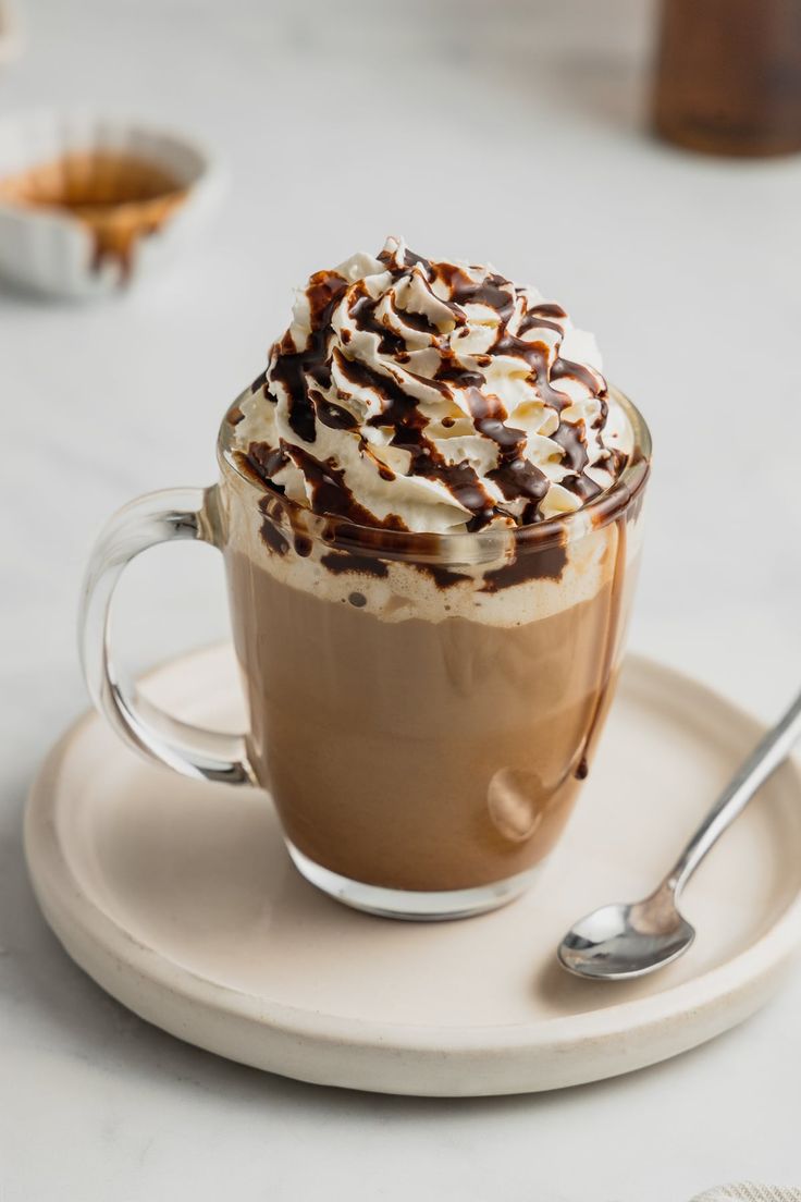 a cup of hot chocolate with whipped cream on top