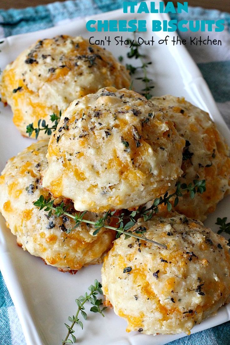 cheese biscuits on a white plate with herbs